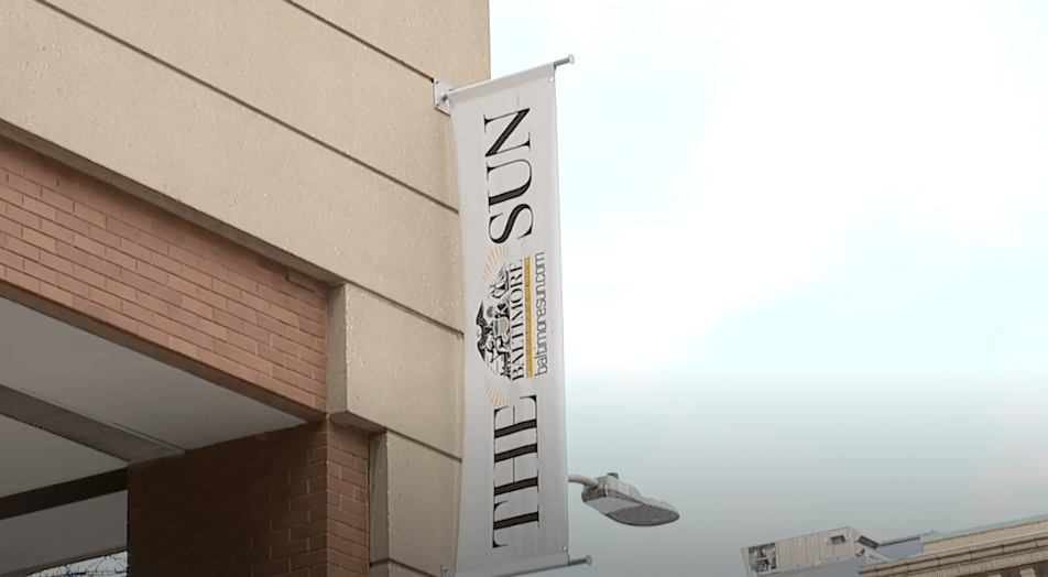 Photo of The Baltimore Sun's banner outside their offices