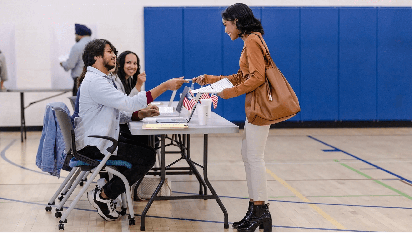 Students working as poll workers during an election.