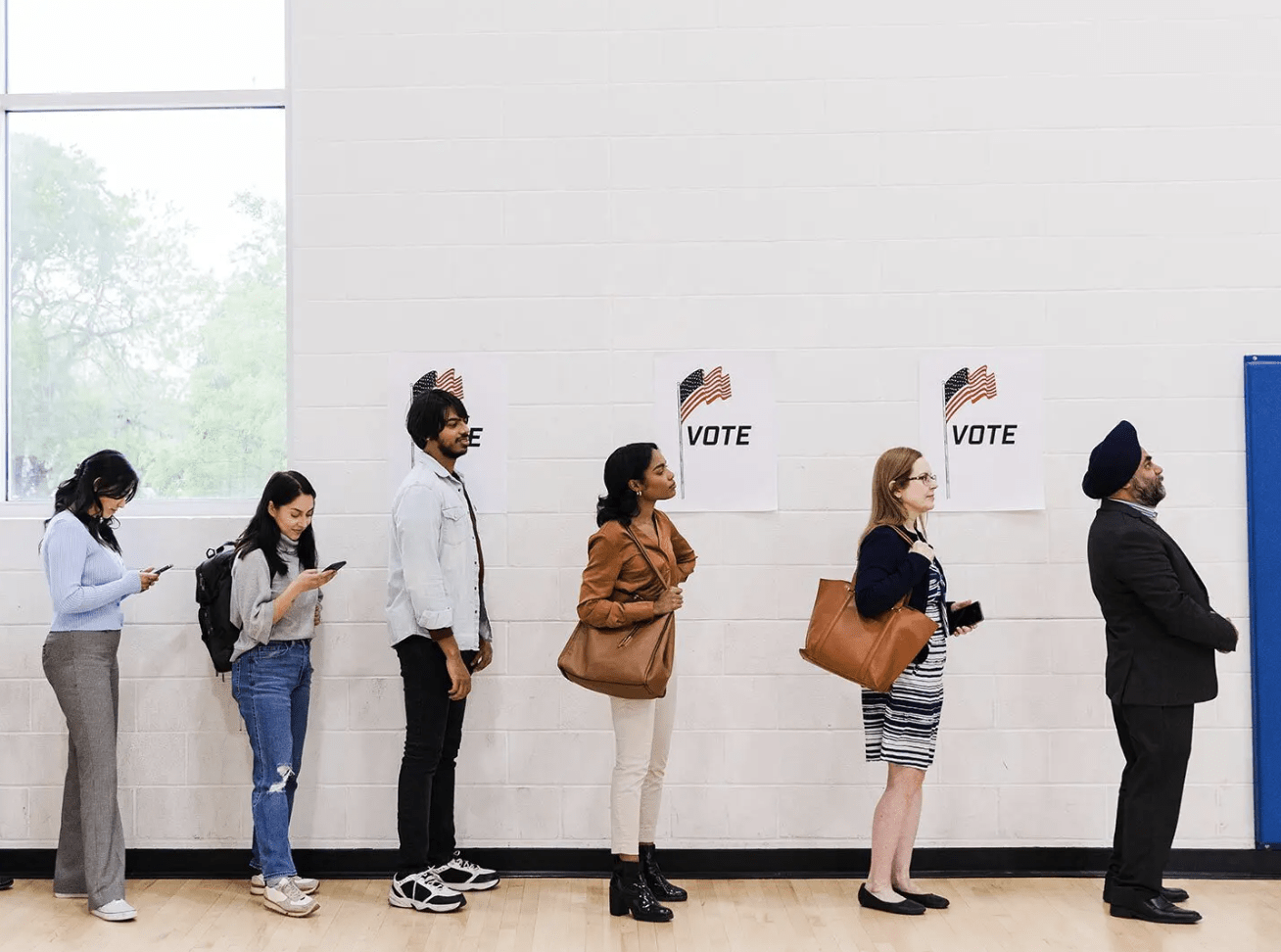 Photo of people standing in line to vote.