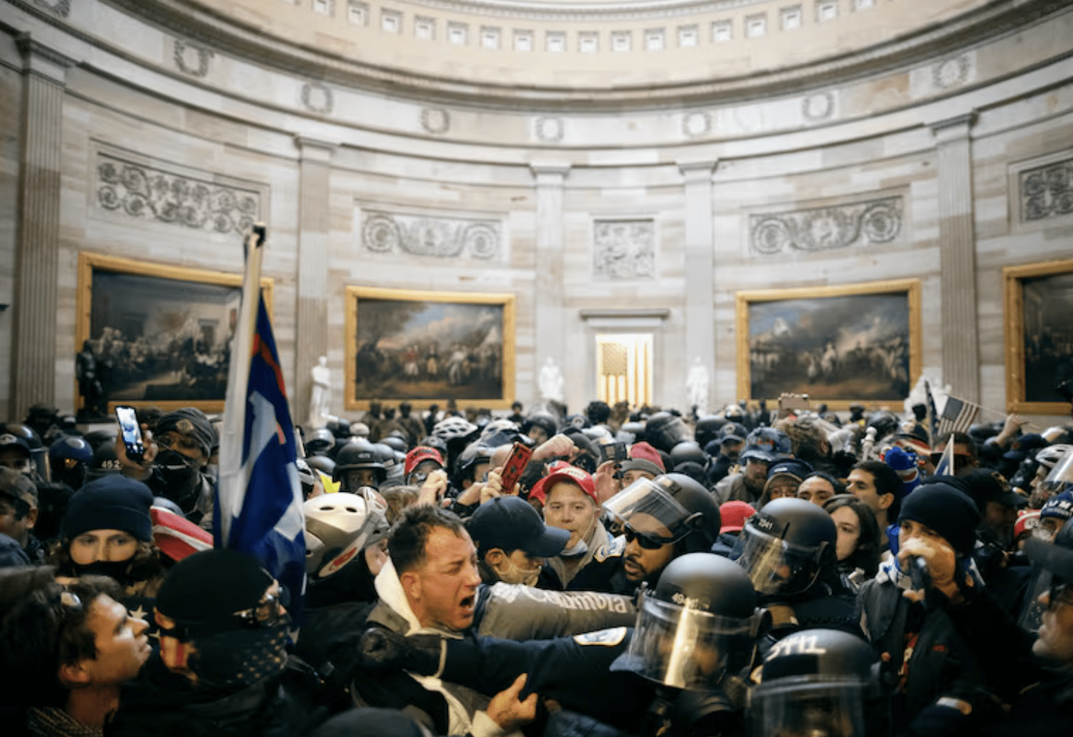 Police clash with supporters of President Donald Trump who breached security and entered the Capitol building in Washington D.C., on Jan. 6, 2021.  Mostafa Bassim / Anadolu Agency via Getty Images