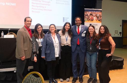 Photo of MDI team members and interns with President Pines at the SLSV National Summit.