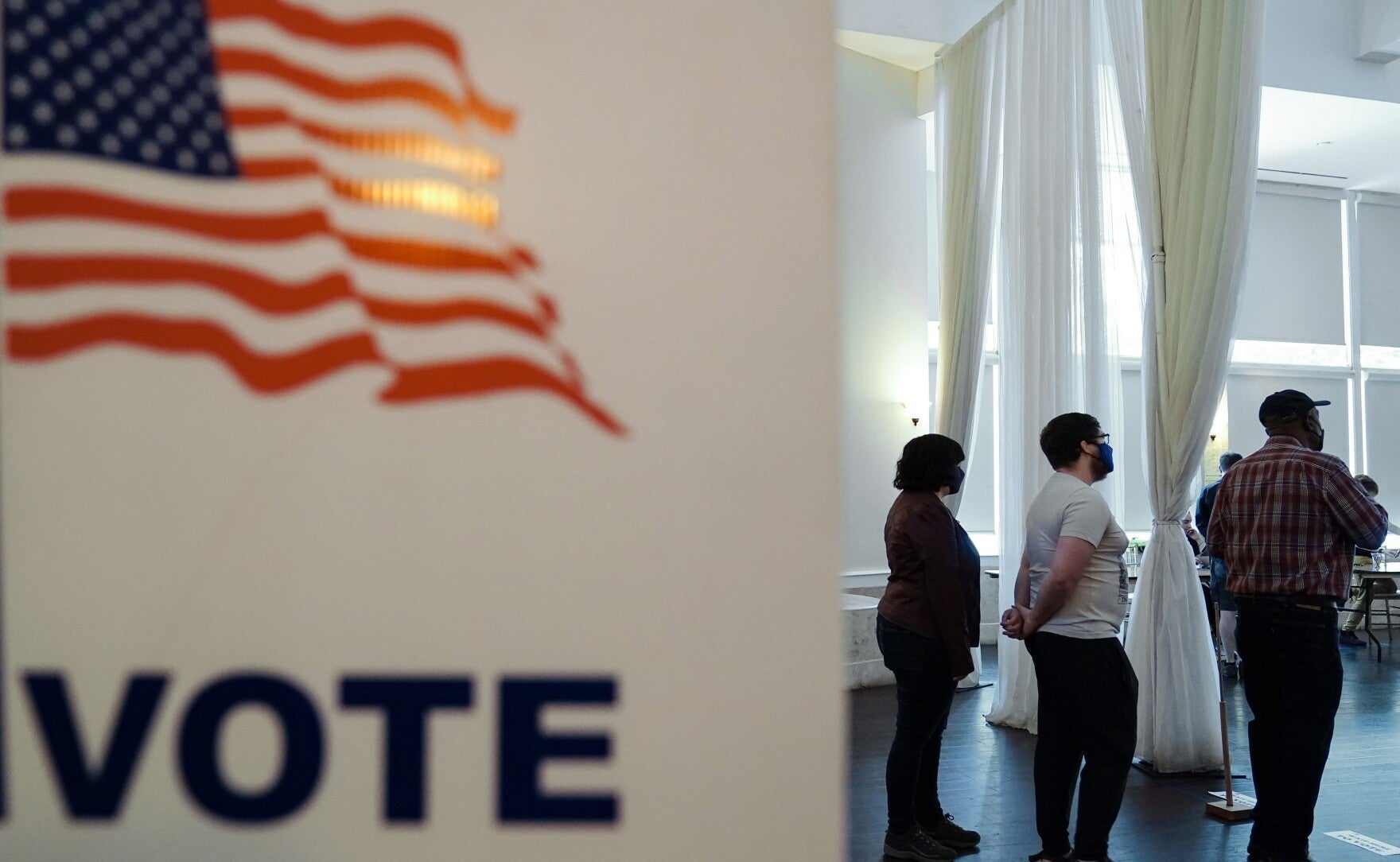 People wait in line to vote in Georgia's 2022 primary election in Atlanta.