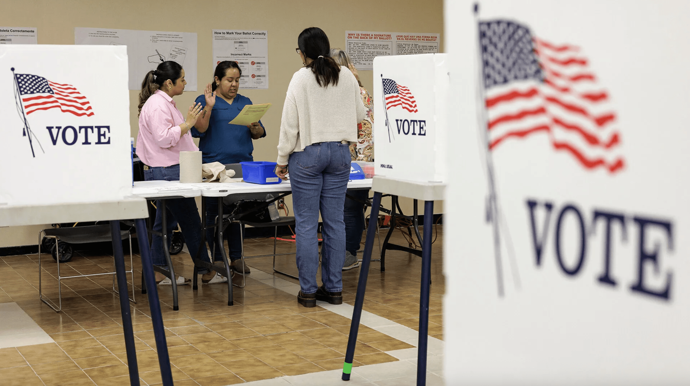 Poll workers take their oaths at the Cameron County, Texas Courthouse in March 2024. The new Election Resilience Lab at UMD will bring together researchers and practitioners to examine the increased demands that election officials face. (Photo by Michael Gonzalez/Getty Images)